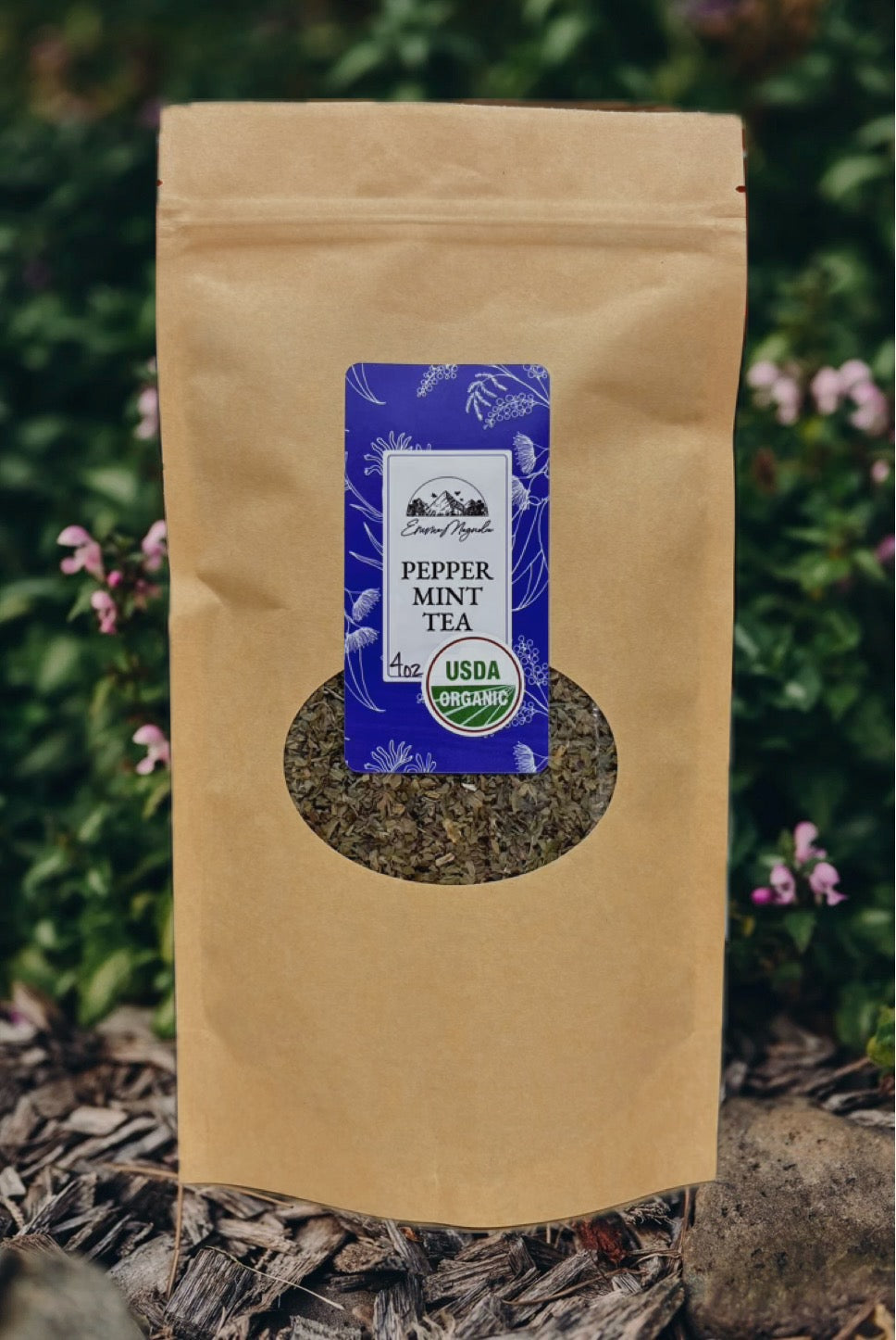 Brown paper bag with a label for pepper mint tea against a natural background