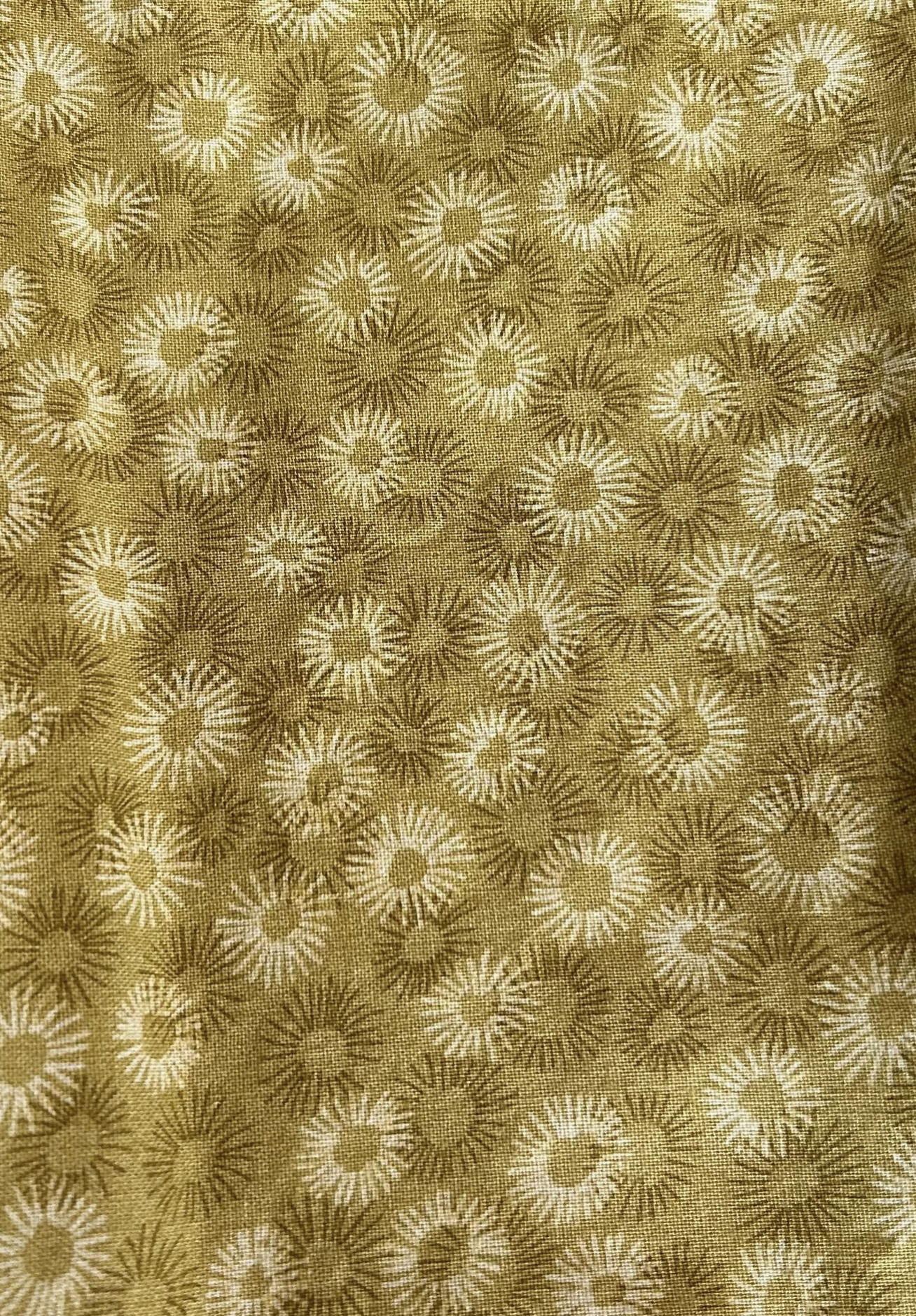 Patterned fabric with floral design in beige and brown tones