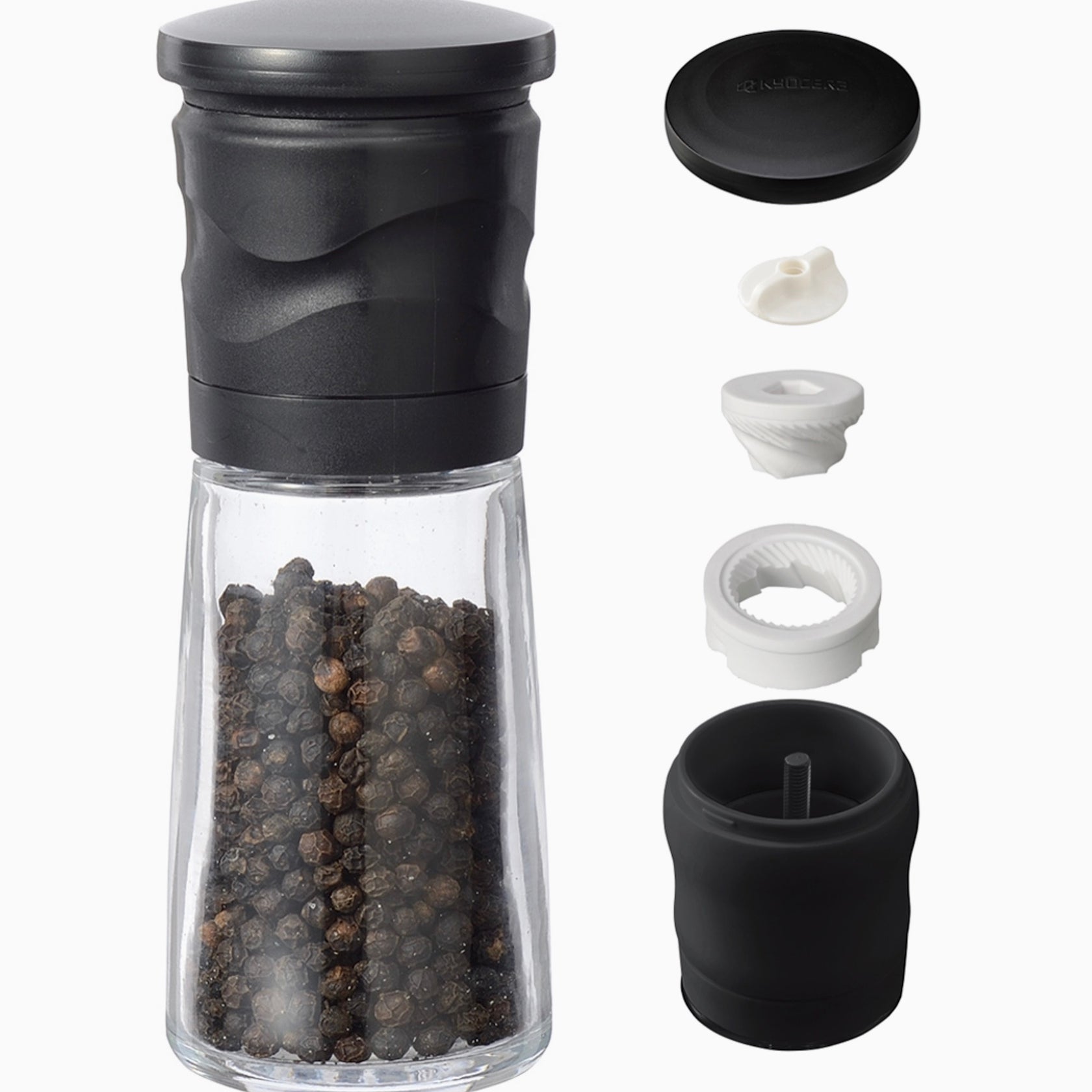 Black pepper grinder with detachable parts on a white background