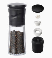 Black pepper grinder with detachable parts on a white background